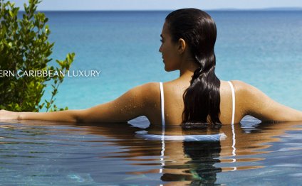 Woman In Caribbean Resort Pool